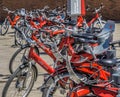 Hamburg, Germany, June 6., 2018: A lot of red rental bikes with red frames and black saddles, deliberately low depth of field