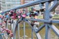 Hamburg, Germany, 1.08.2023, many closed heart love locks on bridge