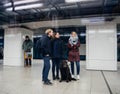 Group of friends waiting the train in underground railway statio