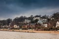 Beautiful houses and beaches on the banks of Elbe river in Hamburg on a cold end of winter day Royalty Free Stock Photo