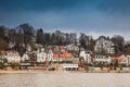 Beautiful houses and beaches on the banks of Elbe river in Hamburg on a cold end of winter day Royalty Free Stock Photo