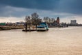 Ferry navigating on the Elbe river in a cold cloudy winter day in Hamburg Royalty Free Stock Photo