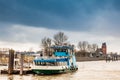 Ferry navigating on the Elbe river in a cold cloudy winter day in Hamburg Royalty Free Stock Photo