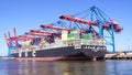 HAMBURG, GERMANY - MARCH 8th, 2014: View on the Burchardkai of the Hamburg harbor. Container ship from MSC is unloaded Royalty Free Stock Photo