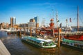 Hamburg, Germany - May 17, 2018: HafenCity, Speicherstadt: Panoramic view of Red fire patrol boat with a restaurant on Royalty Free Stock Photo