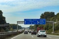 View at traffic signs on the german Highway called A7 from inside a car