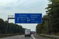 View at traffic signs on the german Highway called A7 from inside a car
