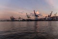 Cranes at Hamburg Harbour at Sunset Royalty Free Stock Photo