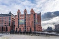 Hamburg, Germany - November 9, 2019: Neo-gothic red brick maritime museum in Hamburg Habor area with clouds