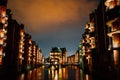 Hamburg, Germany. View of Wandrahmsfleet at dusk illumination light with clouds above. Located in Warehouse District -