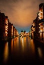 Hamburg, Germany. View of Wandrahmsfleet at dusk illumination light with reflection in the water. Located in Warehouse