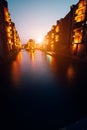 Hamburg, Germany. View of Wandrahmsfleet during sunset with illuminated buildings. Warehouse Landmark District -