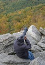 Hamburg, Pennsylvania, U.S - October 15, 2023 - A man taking pictures of wild birds with his long lens camera by Hawk Mountain