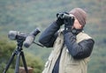 Hamburg, Pennsylvania, U.S - October 15, 2023 - A park ranger watching the birds with this binocular by Hawk Mountain