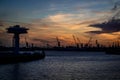 Hamburg port on sunset. Carnes silhouette Royalty Free Stock Photo