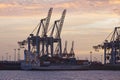 Hamburg - Port at sunset with container gantry cranes Royalty Free Stock Photo