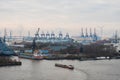 Hamburg. View of the city port with ships and docks, cargo cranes and warehouses Royalty Free Stock Photo