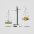 Hamburger and apple on scales