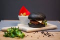 Hamburger with Beyond Burger meatless patty on a wooden board and decoration Royalty Free Stock Photo