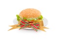 Hamburger with bologna and tomato on white dish Royalty Free Stock Photo