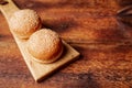 Hamburger buns. Sesame seeds on top. Wooden background. Food concept. Place for text Royalty Free Stock Photo