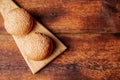 Hamburger buns. Sesame seeds on top. Wooden background. Food concept. Place for text Royalty Free Stock Photo