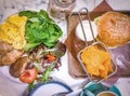 Hamburger, cheese chips, bread, tomato, egg and vegetable salad Royalty Free Stock Photo