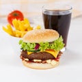 Hamburger Cheeseburger meal fastfood fast food with cola drink and French Fries on a wooden board square Royalty Free Stock Photo