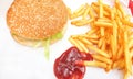 Hamburger classic burger american cheeseburger with cheese, bacon, tomato, lettuce and french fries, fried potatoes with ketchup Royalty Free Stock Photo