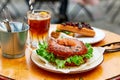 hamburger in the form of a dout, sandwiches, coffee, lots of food on a wooden table Royalty Free Stock Photo