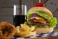 Hamburger, french fries and cold drink on table Royalty Free Stock Photo