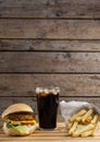 Hamburger, french fries and cold drink on table Royalty Free Stock Photo