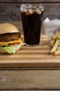 Hamburger, french fries and cold drink on table Royalty Free Stock Photo