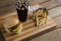 Hamburger, french fries and cold drink on table Royalty Free Stock Photo