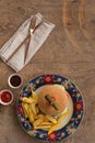 Hamburger with french fries in plate with ornaments