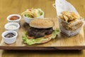 Hamburger with fried potatoes and salad Royalty Free Stock Photo