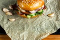 Hamburger with garlic is on kraft paper. Royalty Free Stock Photo