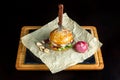 Hamburger with garlic is on kraft paper. Royalty Free Stock Photo