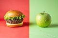 a hamburger and a green apple