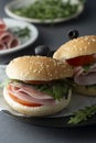 Hamburger with ham. Two burgers, hoemmade food. healthy sandwich with fresh vegetables Royalty Free Stock Photo