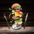 Hamburger ingredients falling down one by one to create a perfect meal. Colorful conceptual picture of burger cooking Royalty Free Stock Photo