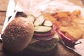 Hamburger with meat cutlet. Potato chips and beer Royalty Free Stock Photo