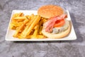 hamburger plate with egg,bacon and french fries Royalty Free Stock Photo