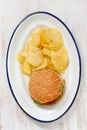 hamburger with potato chips on white dish Royalty Free Stock Photo