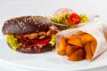 Hamburger sandwich, fried potatoes, fresh salad, served in restaurant, white background, menu food photo