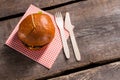 Hamburger on stick and cutlery.