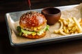 Hamburger with tavern. Lies on aluminum cuvettes. Royalty Free Stock Photo