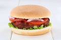 Hamburger tomatoes lettuce wooden board