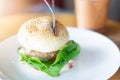 Hamburger in a white ceramic dish at restaurant Royalty Free Stock Photo