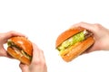 Hamburger in woman hands isolated on a white background Royalty Free Stock Photo